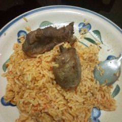 A picture of Jollof rice with chicken.