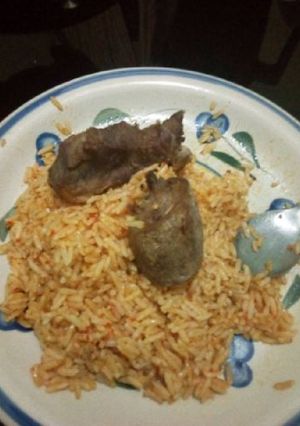 A picture of Jollof rice with chicken.