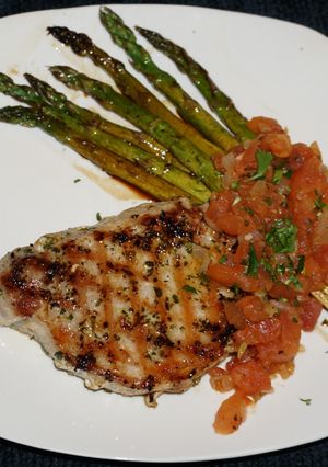 A picture of Grilled Pork Tenderloin Medallions with Fresh Tomato Sauce and Roasted Asparagus, Jon Style.