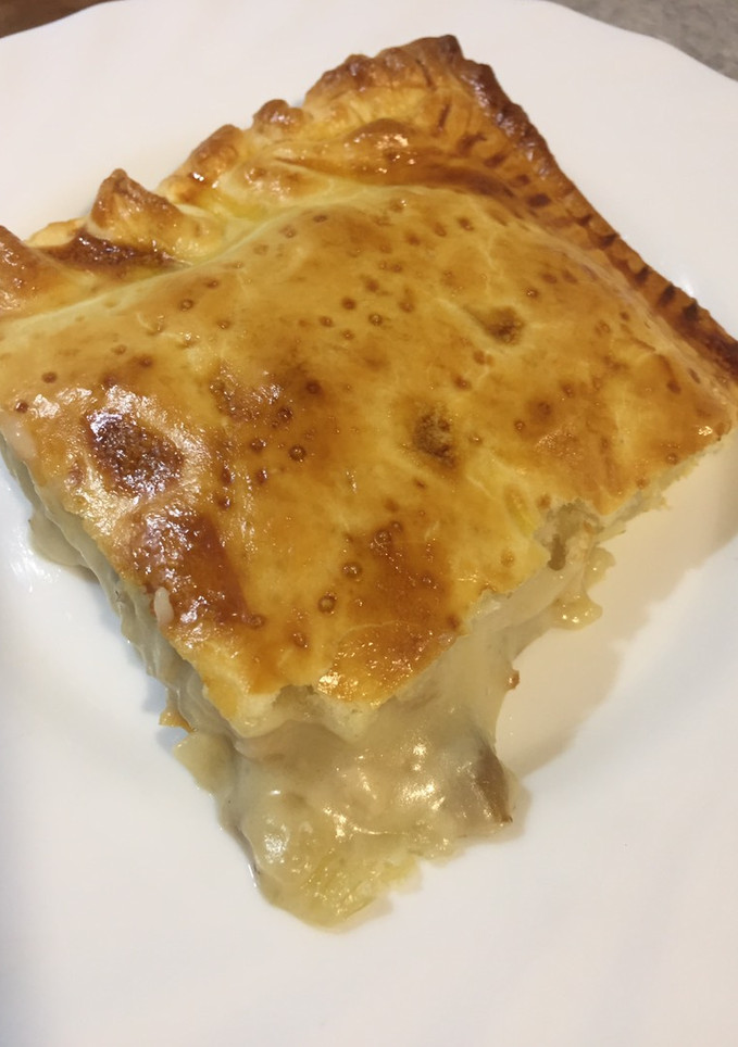 Una foto de Empanada de pollo y setas