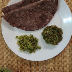 A picture of Ragi Rotti with Roasted Brinjal Chutney and Coconut Chutney.