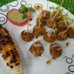 A picture of Corn Pyaji balls (corn onion balls).