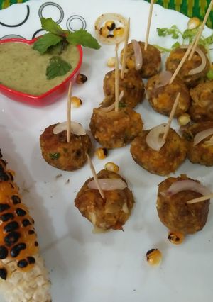 A picture of Corn Pyaji balls (corn onion balls).