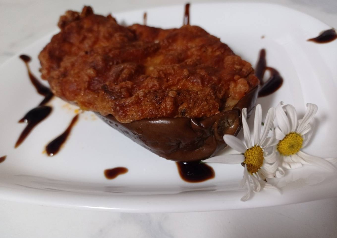 Berenjenas rellenas de verduras gratinadas con queso de cabra