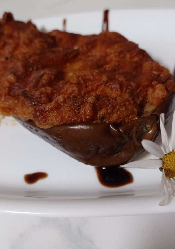 Una foto de Berenjenas rellenas de verduras gratinadas con queso de cabra
