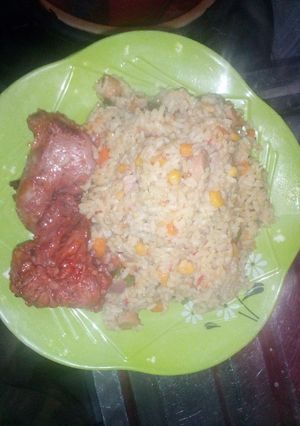 A picture of Coconut rice with peppered chicken.