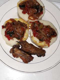 A picture of White yam and stew sauce.