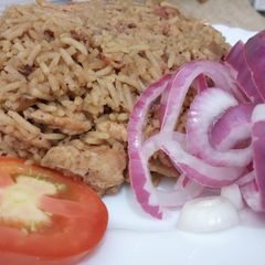 A picture of Chicken and sausage pilau.