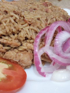 A picture of Chicken and sausage pilau.