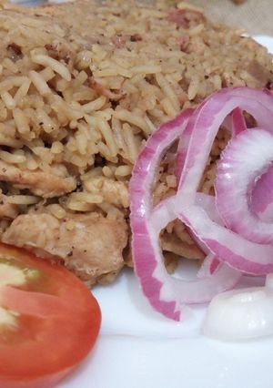 A picture of Chicken and sausage pilau.