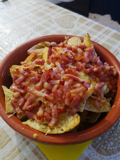 Una foto de Nachos con bacon