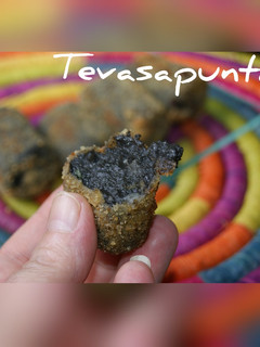 Una foto de Croquetas de calamares en su tinta