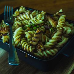 A picture of Dry Roasted Fussili in sautéed vegetables.