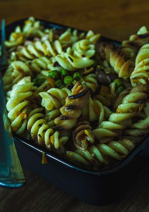 A picture of Dry Roasted Fussili in sautéed vegetables.