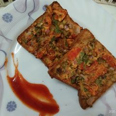 BREAD PIZZA. WITH VEGETABLES A picture of BREAD PIZZA. WITH VEGETABLES.