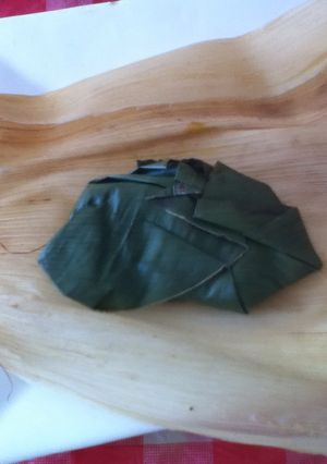 Una foto de Tamal de huitlacoche en hoja de plátano correa