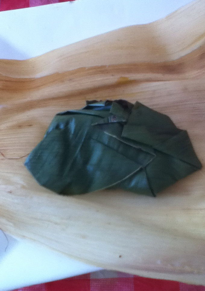 Una foto de Tamal de huitlacoche en hoja de plátano correa