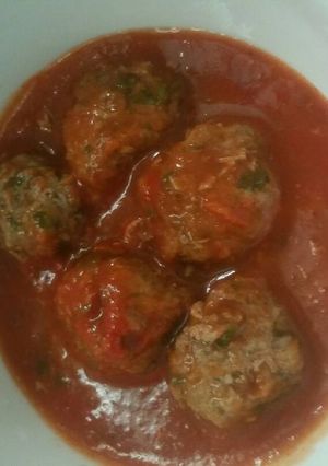 A picture of Kofta with Tomato Sauce.