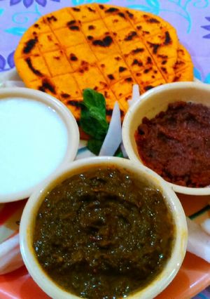 A picture of Sarso ka saag with makki roti.