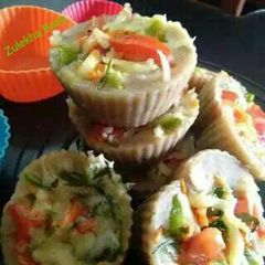 A picture of Brown bread Veggie idli cup cake.