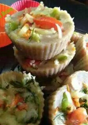 A picture of Brown bread Veggie idli cup cake.