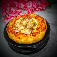 A picture of Cheese Brust onion Pizza.