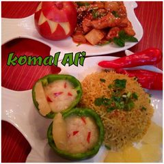 A picture of Sesame pineApple chicken with Rice nd PINEAPPLE AND APPLE SAUCE.