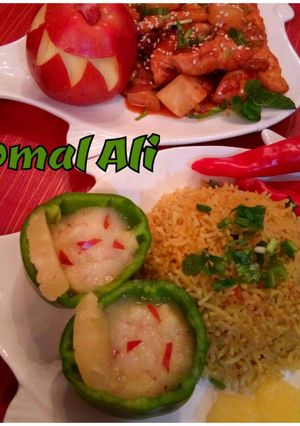 A picture of Sesame pineApple chicken with Rice nd PINEAPPLE AND APPLE SAUCE.