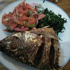 A picture of Fried fish with kachumbari.