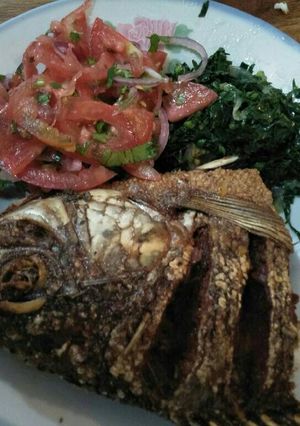 A picture of Fried fish with kachumbari.