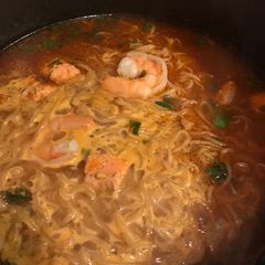A picture of Salmon and shrimp soup.