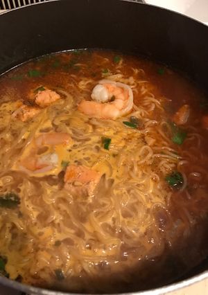 A picture of Salmon and shrimp soup.