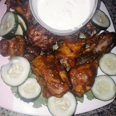 A picture of Nigeria Berbecue chicken style with garlic sauce.