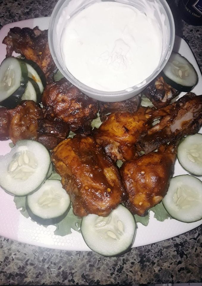 A picture of Nigeria Berbecue chicken style with garlic sauce.