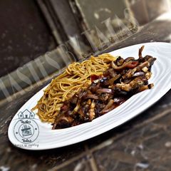 A picture of Fish and onion sauce.