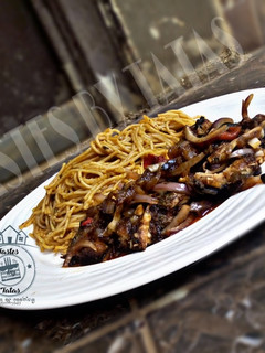 A picture of Fish and onion sauce.