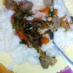 Boiled rice served with beef stew #authormarathon# A picture of Boiled rice served with beef stew #authormarathon#.