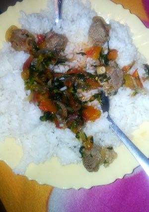 A picture of Boiled rice served with beef stew #authormarathon#.