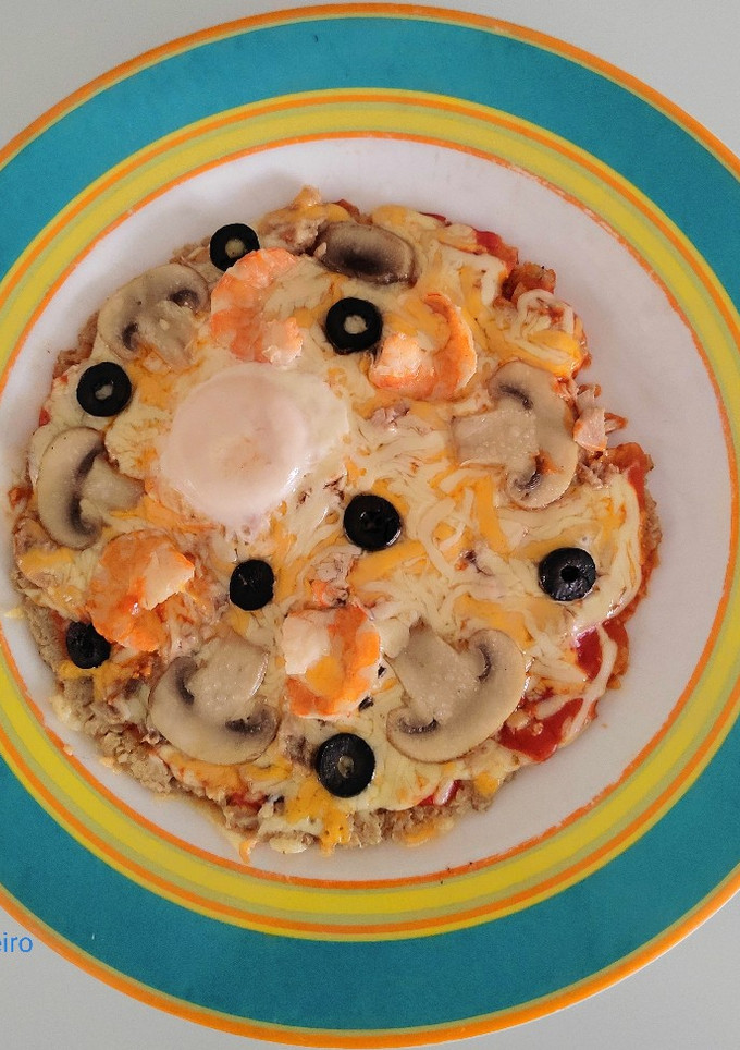 Una foto de Pizza marinera en base de avena sin horno