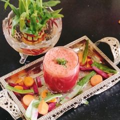A picture of Watermelon juice with sabja seed.