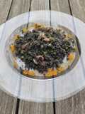 Cous cous al nero di seppia con seppie e piselli