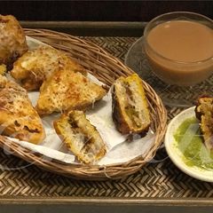 A picture of Pav Bhaji Cheesy Sandwich Pakoda.