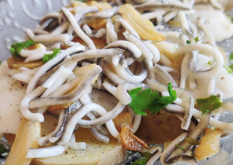 Merluza con gulas al ajillo