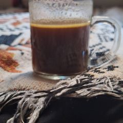 A picture of Keto black coffee, Nescafe with butter and rose water.