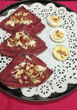 A picture of Protein Loaded Cheesey Egg Stuffed Beetroot Paratha Tortilla Wrap.