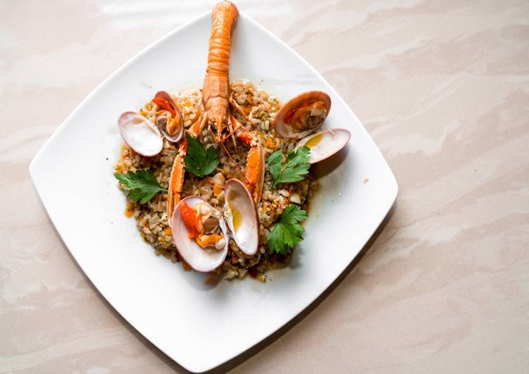 RISO INTEGRALE CON SCAMPI, FASOLARI E CAROTE