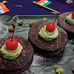 A picture of Mini choco pancakes with tricolour frosting.