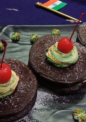 A picture of Mini choco pancakes with tricolour frosting.