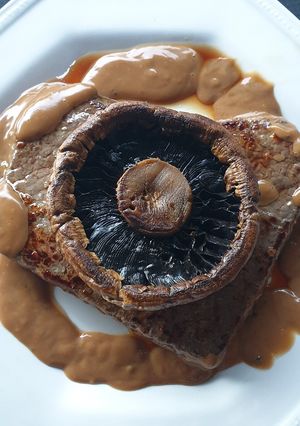 A picture of Minute steak with Portabella mushroom.