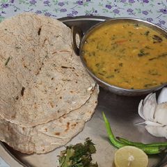 A picture of Methi pithla jowar green garlic bhakri and thecha village style.